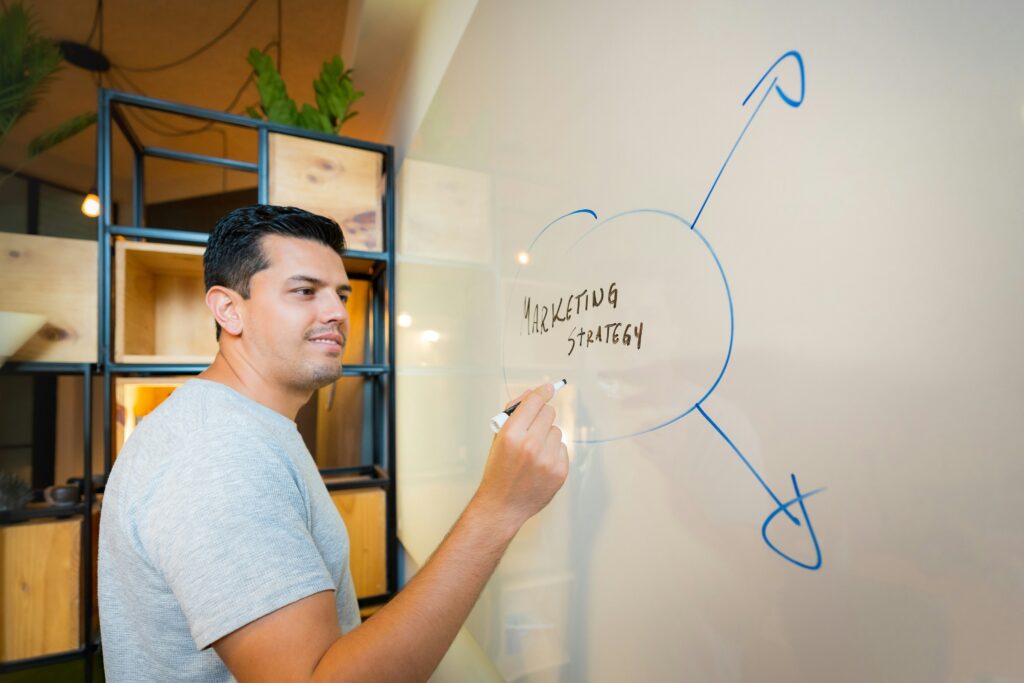 Customer acquisition strategist writing on a whiteboard
